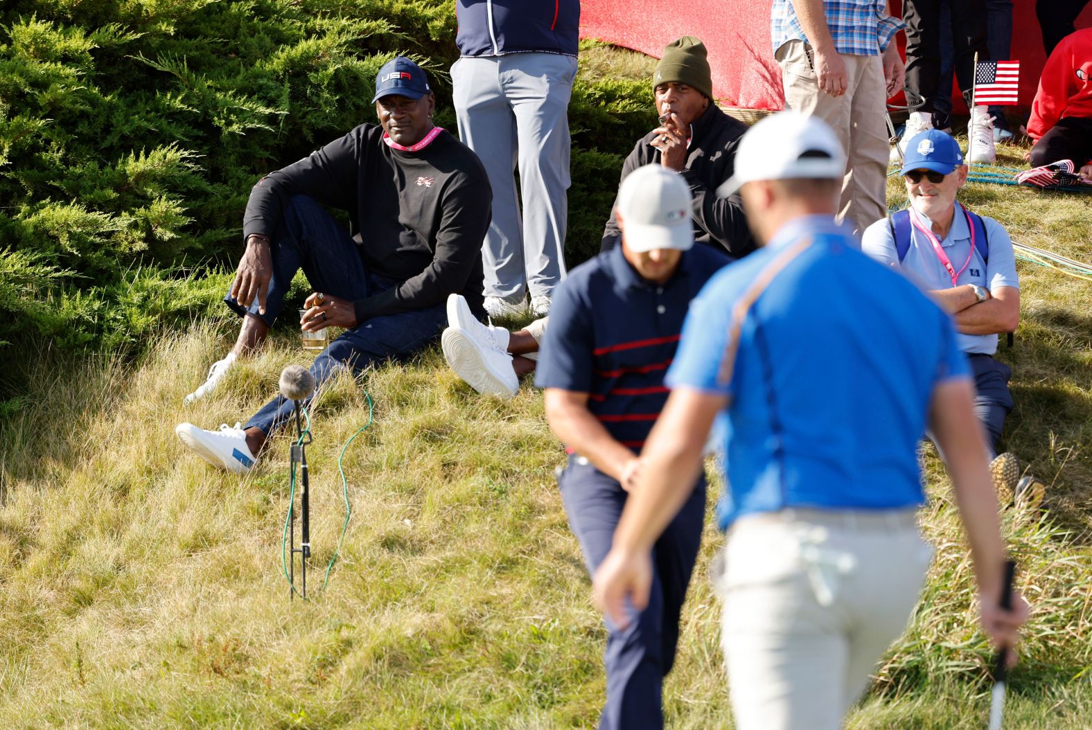 Basketball legend Michael Jordan watches by the 11th green during the Fourballs on day one of the Ryder Cup.