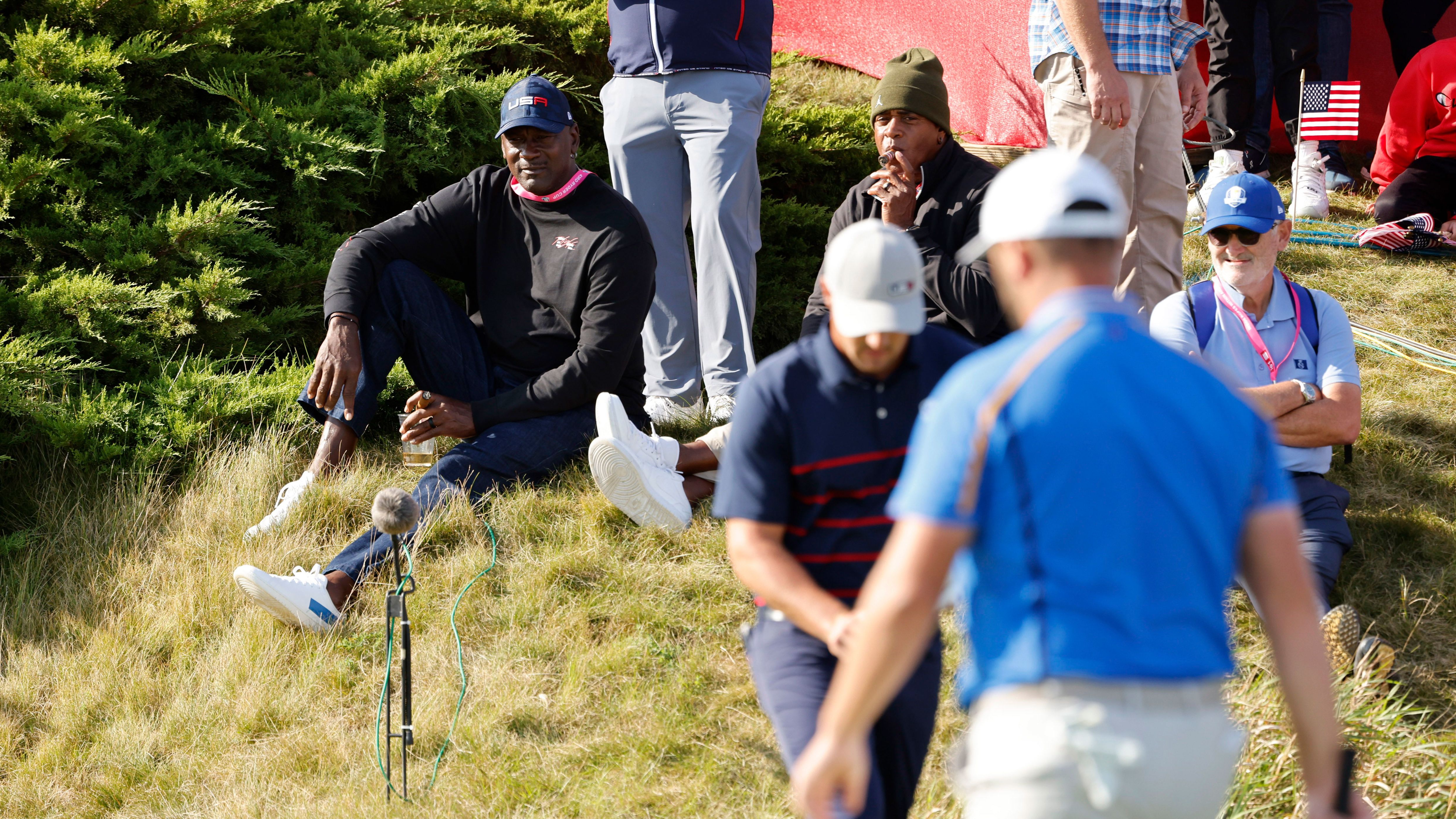 Basketball legend Michael Jordan watches by the 11th green during the Fourballs on day one of the Ryder Cup.