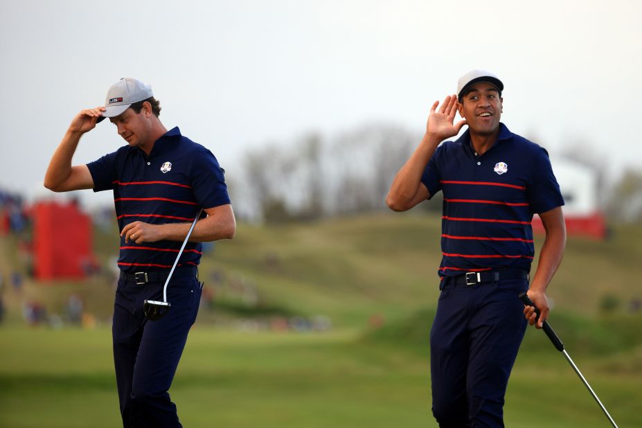 Harris English (left) and Tony Finau celebrate on the 15th green after winning their Fourball match.
