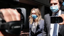 Elizabeth Holmes, founder of Theranos Inc., and husband Billy Evans exit federal court in San Jose, California, U.S., on Wednesday, Sept. 8, 2021. Holmes, 37, faces a dozen fraud and conspiracy counts that could send her to prison for as long as 20 years if shes convicted. Photographer: David Odisho/Bloomberg via Getty Images