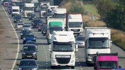 WARRINGTON, ENGLAND - SEPTEMBER 06: Trucks and cars make their way along the busy M6 motorway on September 06, 2021 in Warrington, England. Fallout from Brexit and the Covid-19 pandemic have led to a shortage of HGV (Heavy Goods Vehicles) drivers in the UK, causing supply-chain disruptions and stock shortages across an array of British businesses. (Photo by Christopher Furlong/Getty Images)