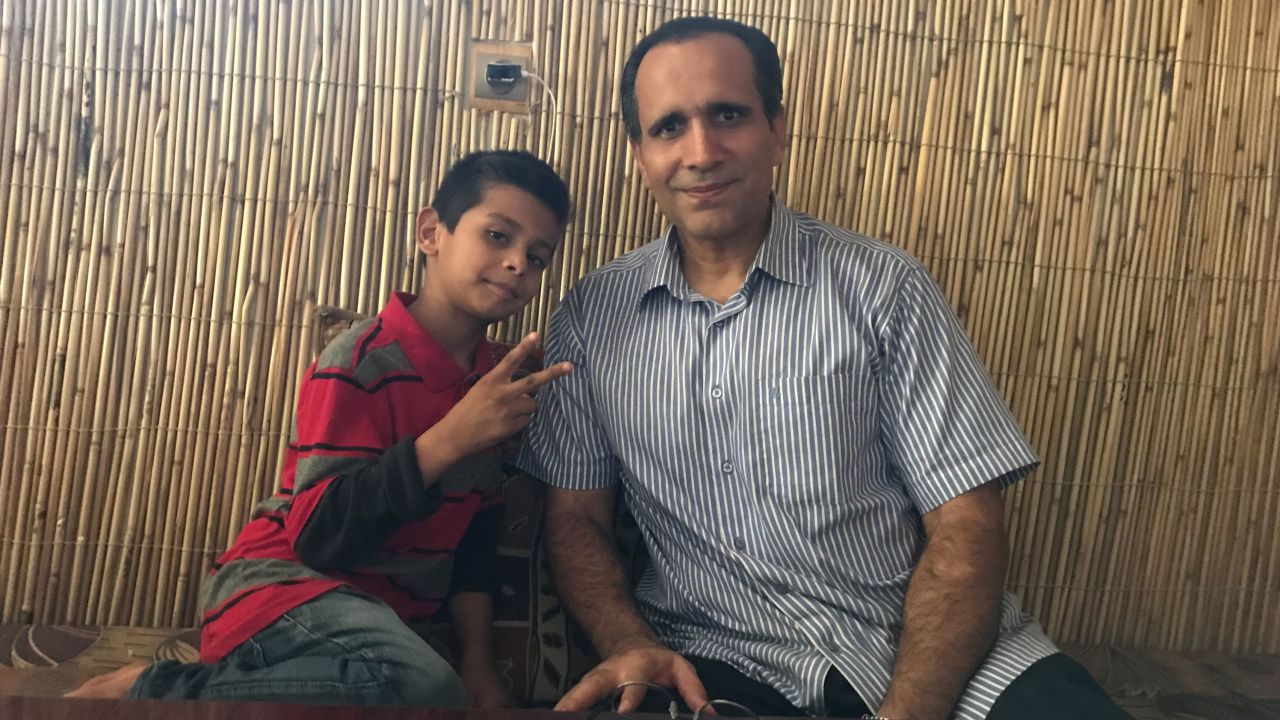 10-year-old Noman Mujtaba with his father Bahaudin Mujtaba
