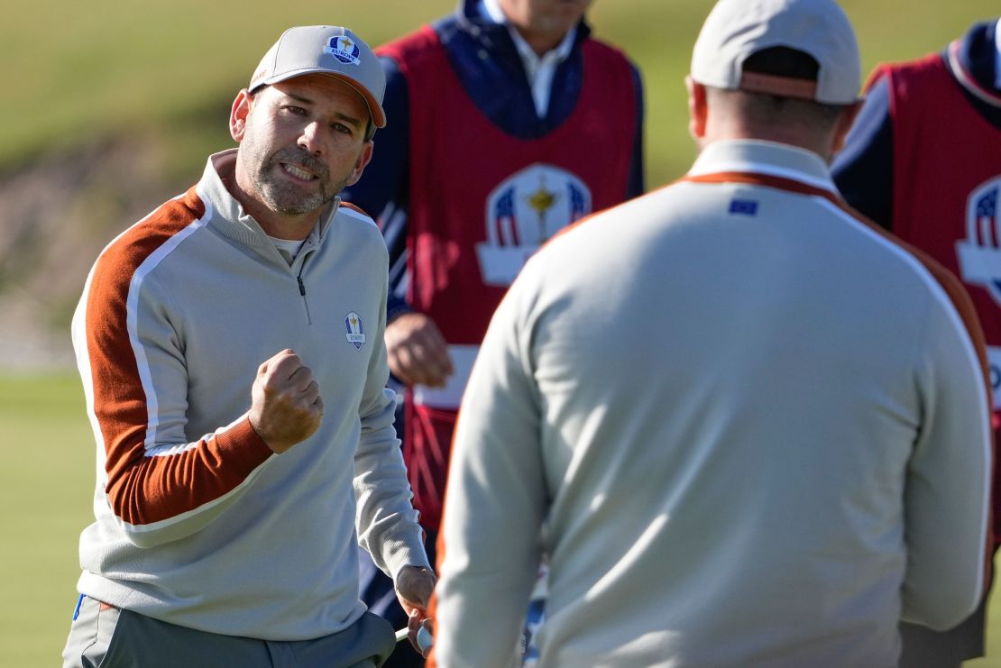 Garcia reacts to a putt on the 8th hole during a foursomes match.