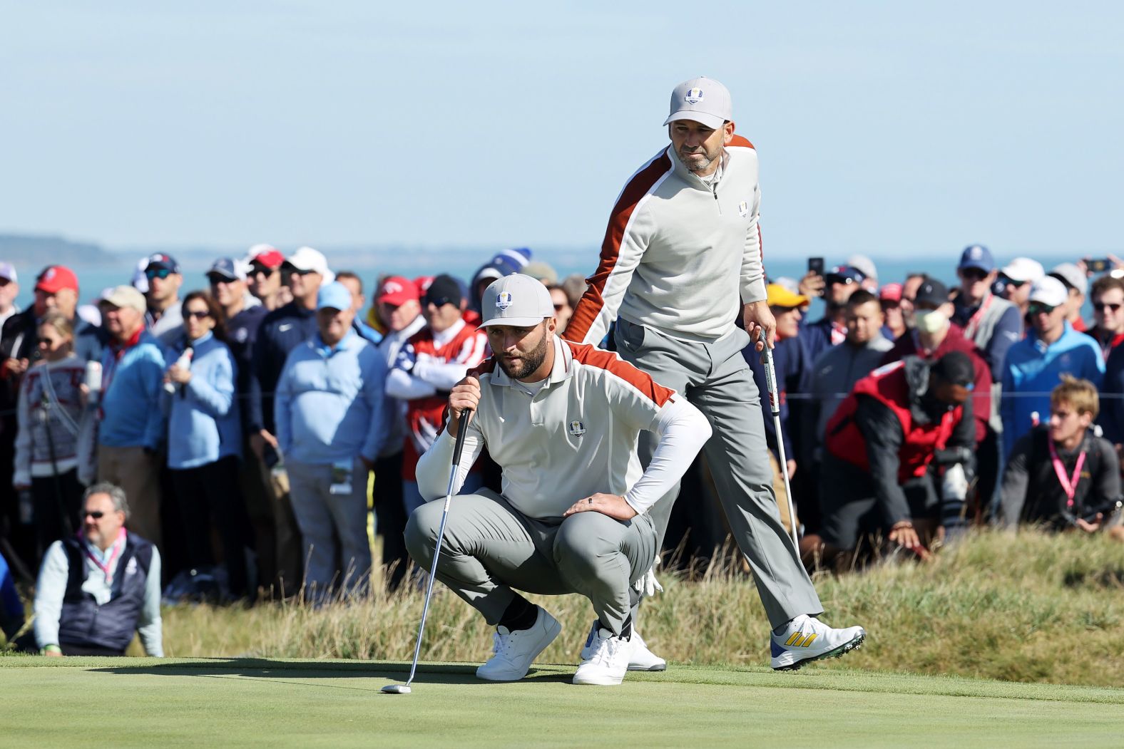 Team Europe's Jon Rahm (left) and Sergio Garcia line up a putt on the 15th green during Saturday morning Foursome matches on September 25. <a href="index.php?page=&url=https%3A%2F%2Fwww.cnn.com%2F2021%2F09%2F25%2Fgolf%2Fsergio-garcia-ryder-cup-history-spt-intl%2Findex.html" target="_blank">Garcia made Ryder Cup history</a> by becoming the player with the most matches won in the tournament's history, after their victory over Brooks Koepka and Daniel Berger of Team US.