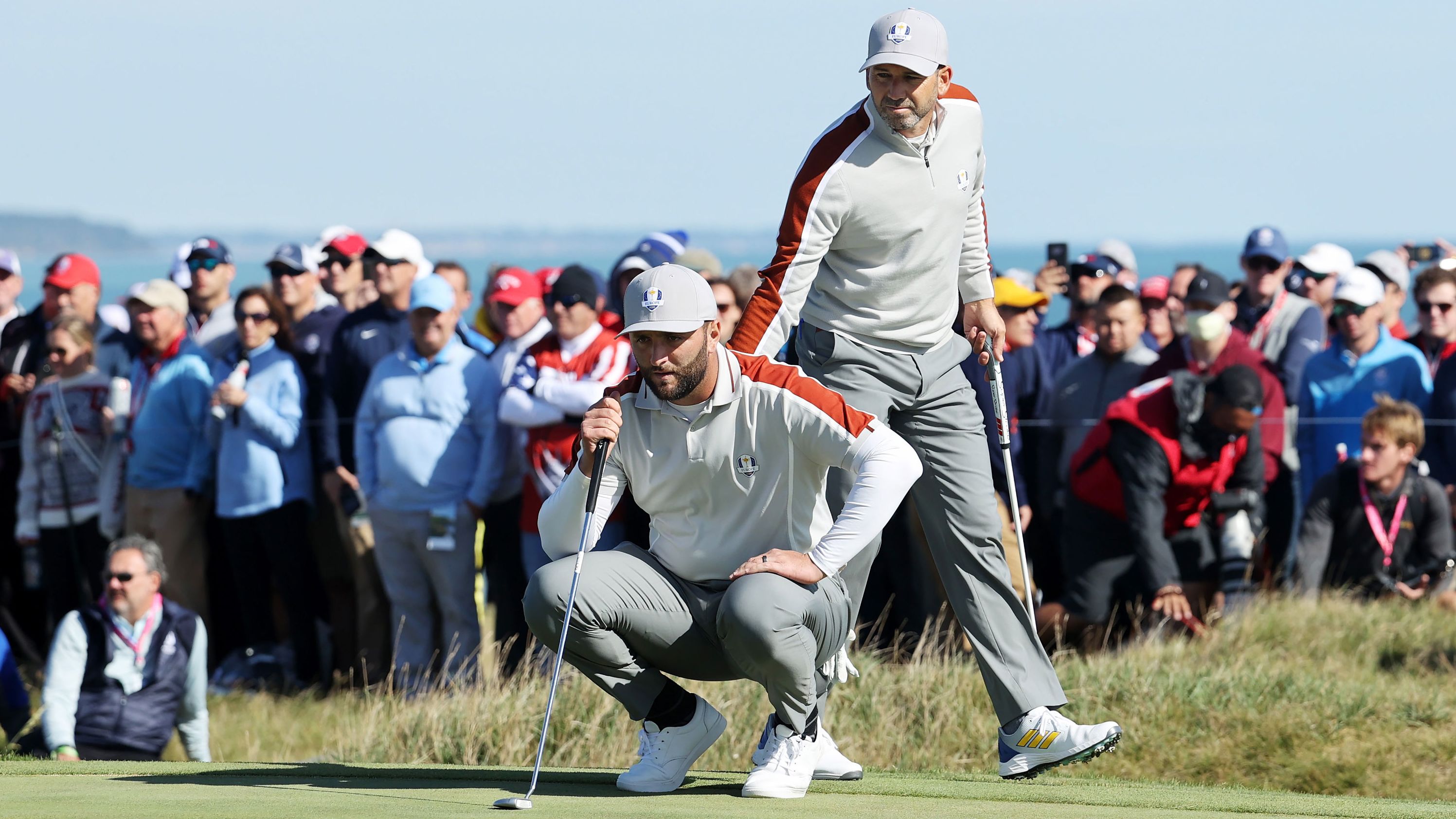 Team Europe's Jon Rahm (left) and Sergio Garcia line up a putt on the 15th green during Saturday morning Foursome matches on September 25. <a href="index.php?page=&url=https%3A%2F%2Fwww.cnn.com%2F2021%2F09%2F25%2Fgolf%2Fsergio-garcia-ryder-cup-history-spt-intl%2Findex.html" target="_blank">Garcia made Ryder Cup history</a> by becoming the player with the most matches won in the tournament's history, after their victory over Brooks Koepka and Daniel Berger of Team US.