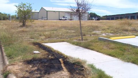 The site where three bodies were found in a burning dumpster in Fort Worth, Texas, this week is seen in this still image from footage by CNN affiliate WFAA. 
