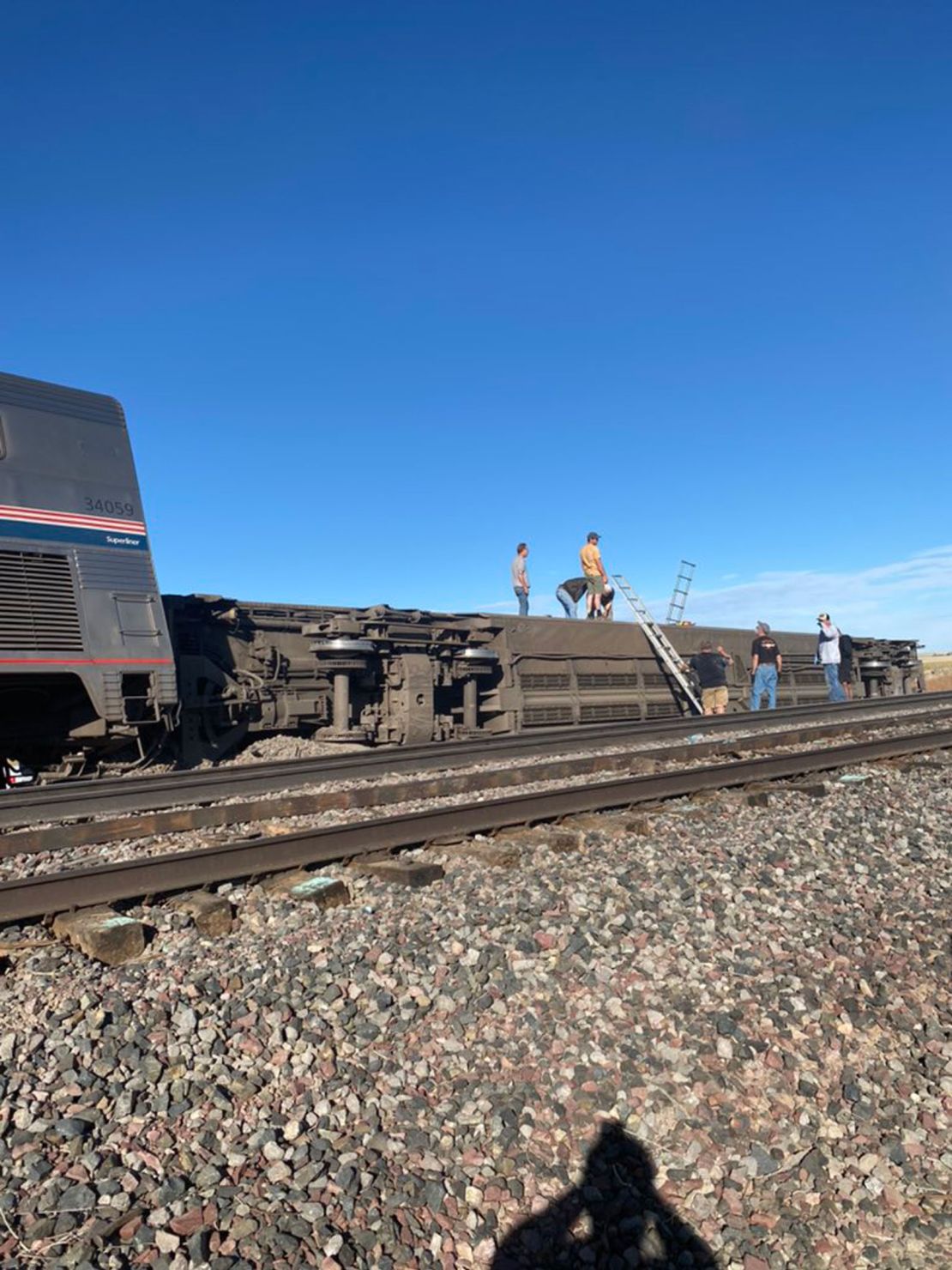 An Amtrak car lies on its side after derailing on Saturday in Montana.