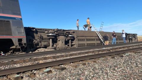 An Amtrak car lies on its side after derailing on Saturday in Montana.