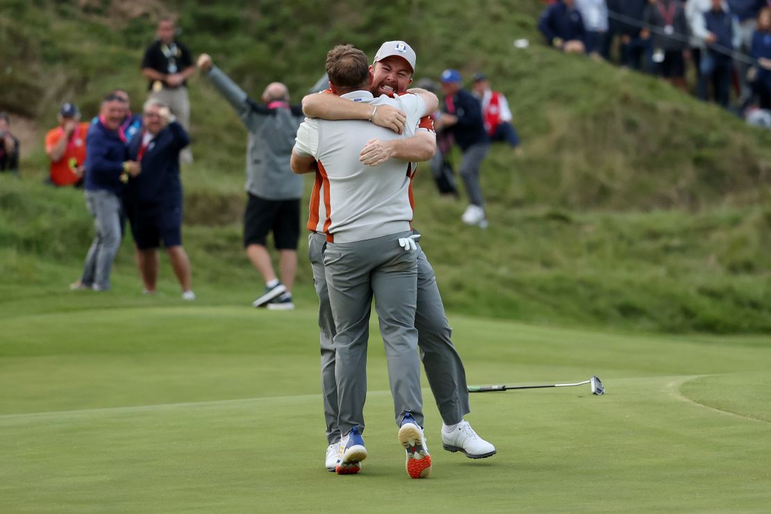 Lowry and Hatton celebrate their win over English and Finau on the 18th green.