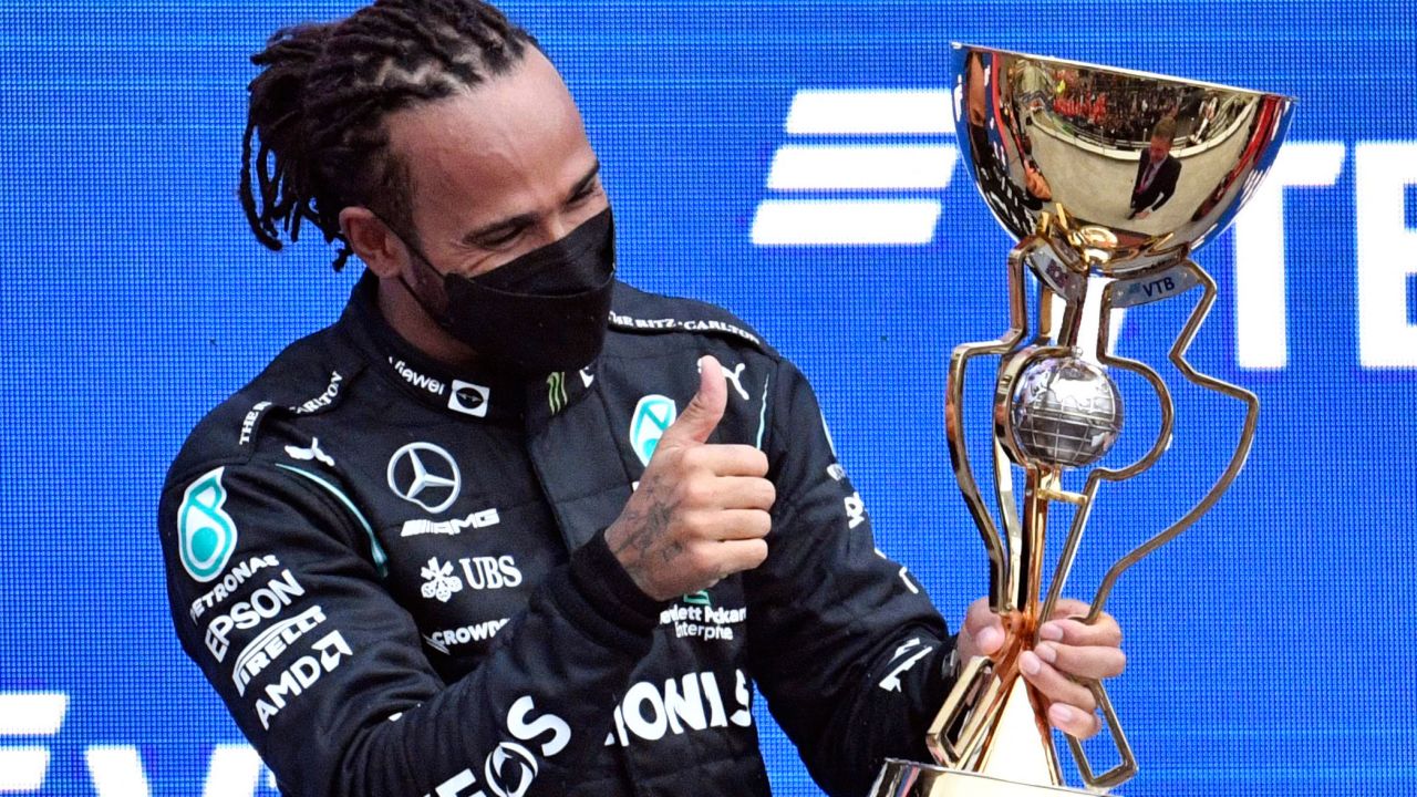 Hamilton celebrates on the podium after winning the Russian Grand Prix.