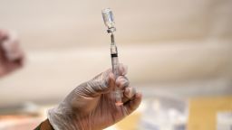 A healthcare worker prepares a syringe with a vial of the J&J/Janssen Covid-19 vaccine at a temporary vaccination site at Grand Central Terminal train station on May 12, 2021 in New York City. (Photo by Angela Weiss / AFP) (Photo by ANGELA WEISS/AFP via Getty Images)