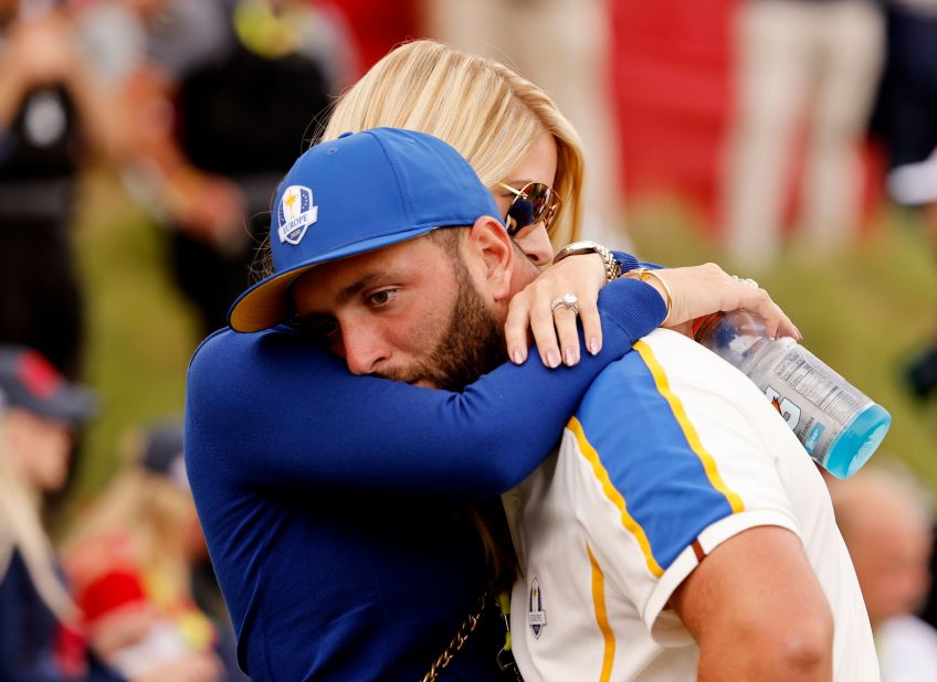 Team Europe's Jon Rahm is consoled by his wife Kelley Cahill after Team US win The Ryder Cup.
