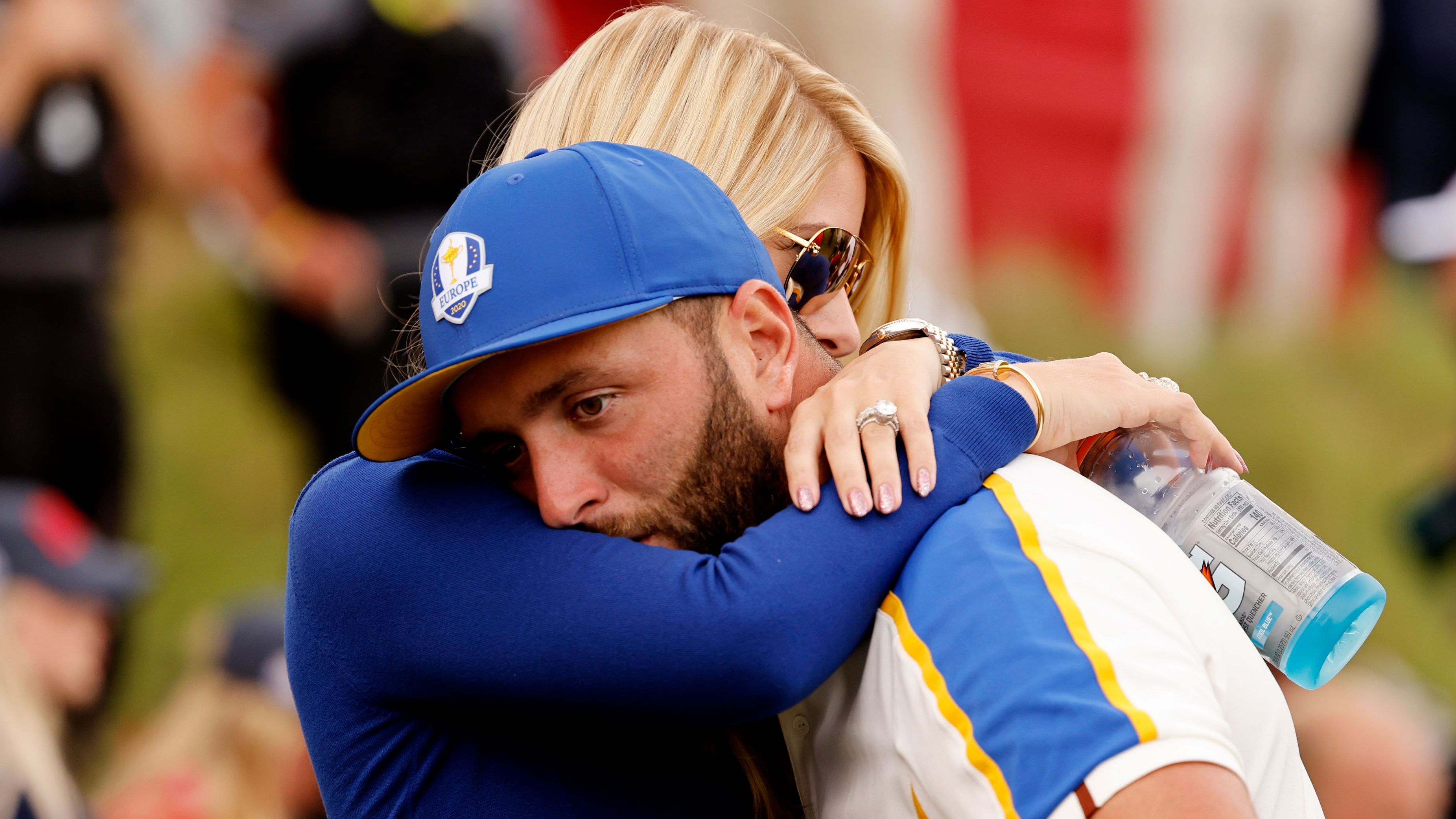Team Europe's Jon Rahm is consoled by his wife Kelley Cahill after Team US win The Ryder Cup.