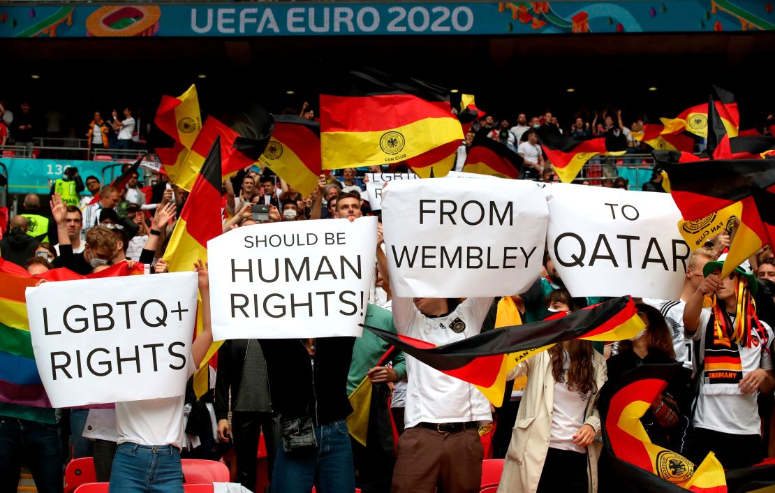 Germany fans hold up signs in relation to LGBTQ+ rights during the UEFA Euro 2020 round of 16 match at Wembley Stadium, London
