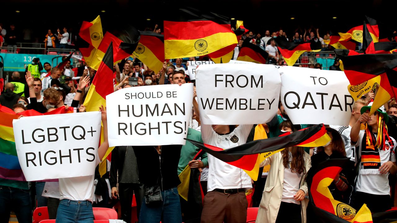 Germany fans hold up signs in relation to LGBTQ+ rights during the UEFA Euro 2020 round of 16 match at Wembley Stadium, London