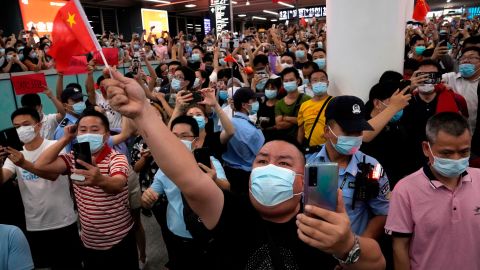 Supporters of Huawei CFO Meng Wanzhou gather at Shenzhen Bao'an International Airport in southern China to welcome her return.