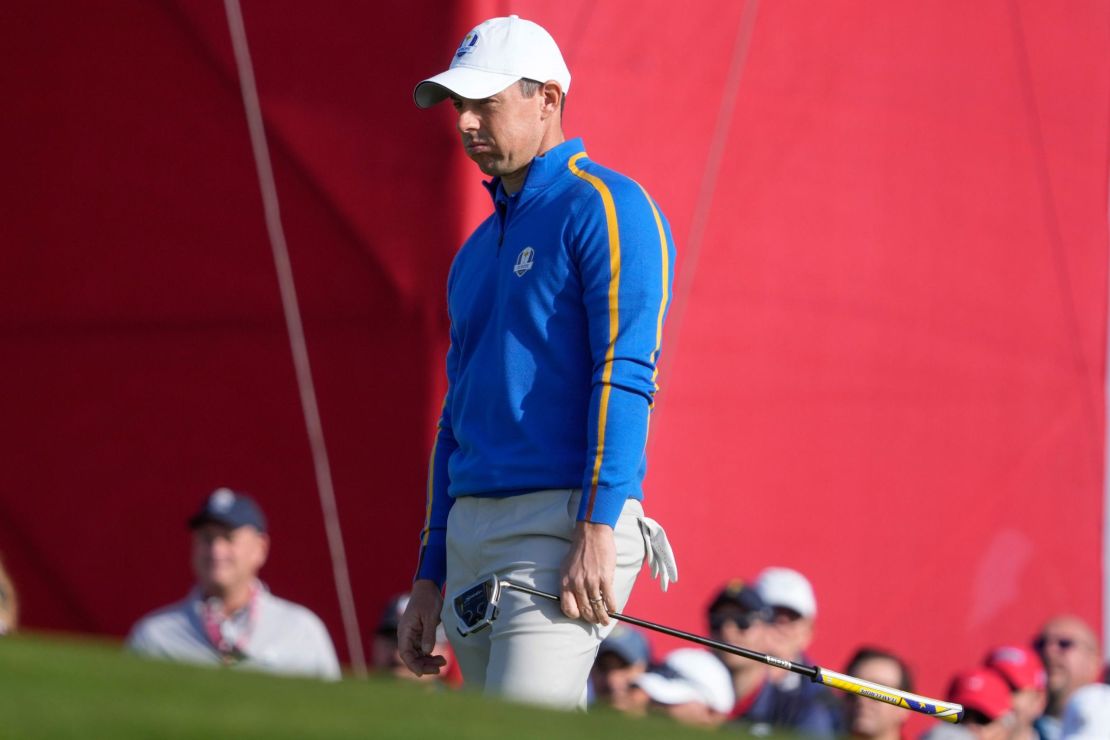 McIlroy reacts to a putt during a foursome match.