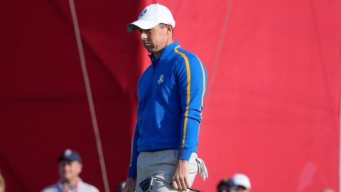 McIlroy reacts to a putt during a foursome match.