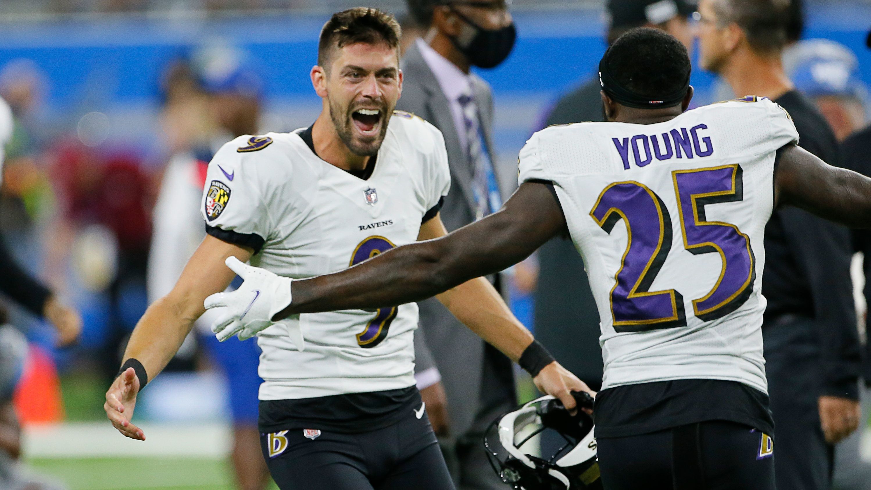Justin Tucker celebrates with Tavon Young after kicking a 66-yard field goal to beat the Detroit Lions.