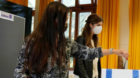 A woman casts her ballot for the abortion referendum at a polling station in San Marino, on September 26.