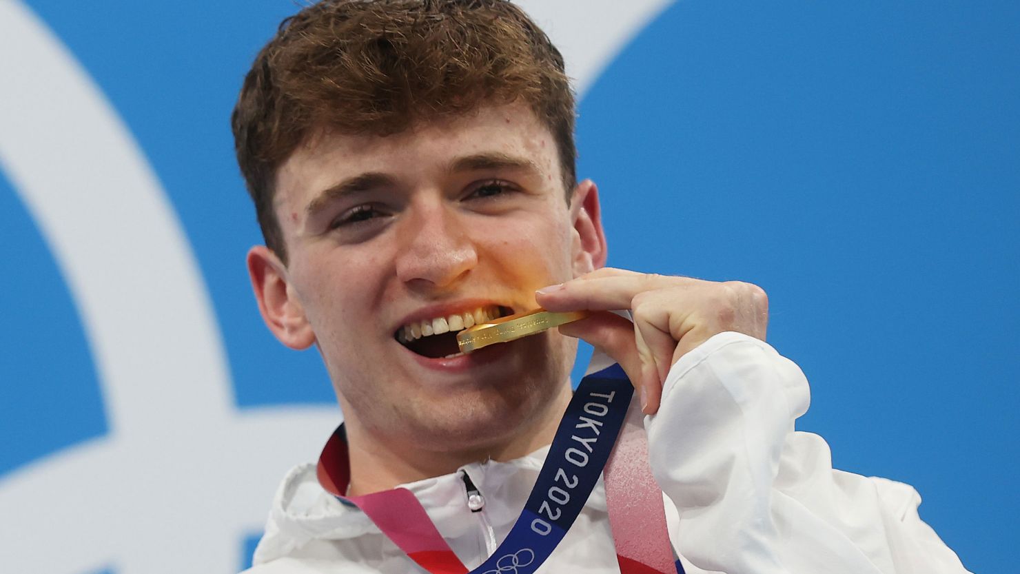 Matty Lee poses with his gold medal at the Tokyo Olympics. 