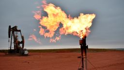 A flare burns natural gas at an oil well Aug. 26, 2021, in Watford City, N.D., part of McKenzie County, the fastest-growing county in the U.S. That's according to new figures from the Census Bureau. (AP Photo/Matthew Brown)