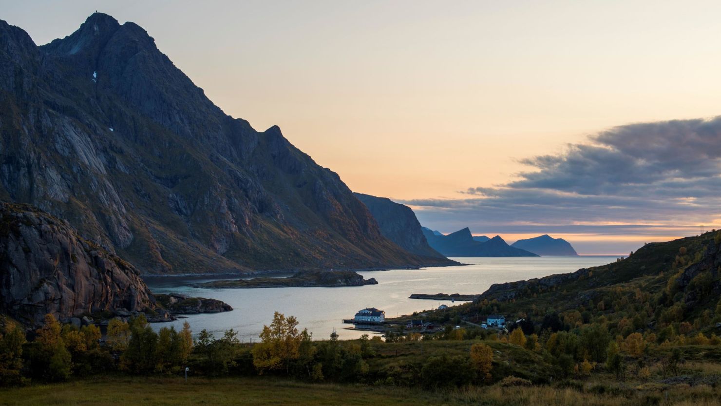 The sun sets in Tangstad fjord, in the arctic circle at the beginning of the fall season, on September 24, 2017. - Water and air temperatures are around 11°C, which is unusually warm for the season. (Photo by OLIVIER MORIN / AFP)        (Photo credit should read OLIVIER MORIN/AFP via Getty Images)