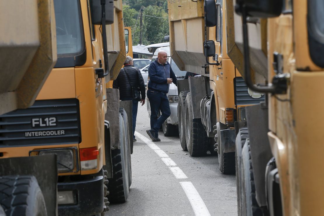 Local Serbs stand beside a roadblock on the route to the northern Kosovo border crossing of Jarinje on September 21.