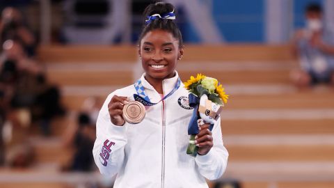 Biles poses with the bronze medal  at Ariake Gymnastics Centre, Tokyo.