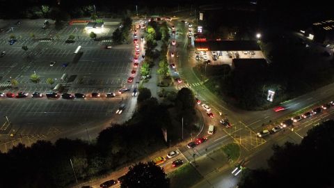 Motorists queue to fill their cars at a Sainsbury's fuel station in Ashford, England,  Saturday, September 25.