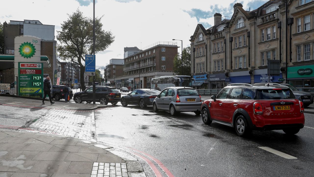 Vehicles are seen outside a petrol station in London on September 27.