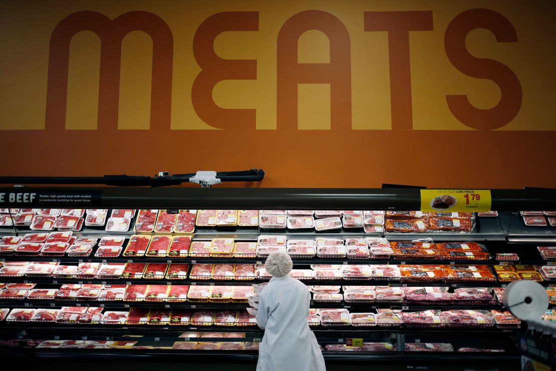 An employee restocks shelves with pork in the meat section at a Kroger Co. supermarket in Louisville, Kentucky, U.S., on Tuesday, March 5, 2019. Kroger Co. is scheduled to release earnings figures on March 7. 