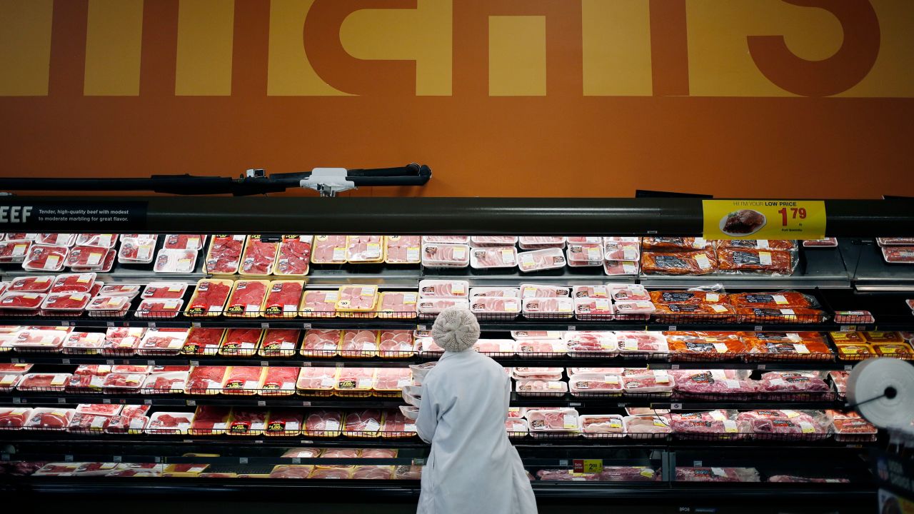 An employee restocks shelves with pork in the meat section at a Kroger Co. supermarket in Louisville, Kentucky, U.S., on Tuesday, March 5, 2019. Kroger Co. is scheduled to release earnings figures on March 7. 