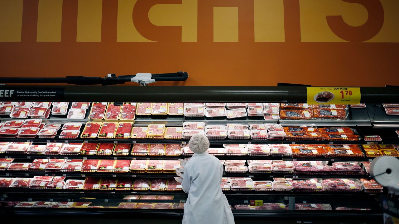 An employee restocks shelves with pork in the meat section at a Kroger Co. supermarket in Louisville, Kentucky, U.S., on Tuesday, March 5, 2019. Kroger Co. is scheduled to release earnings figures on March 7.