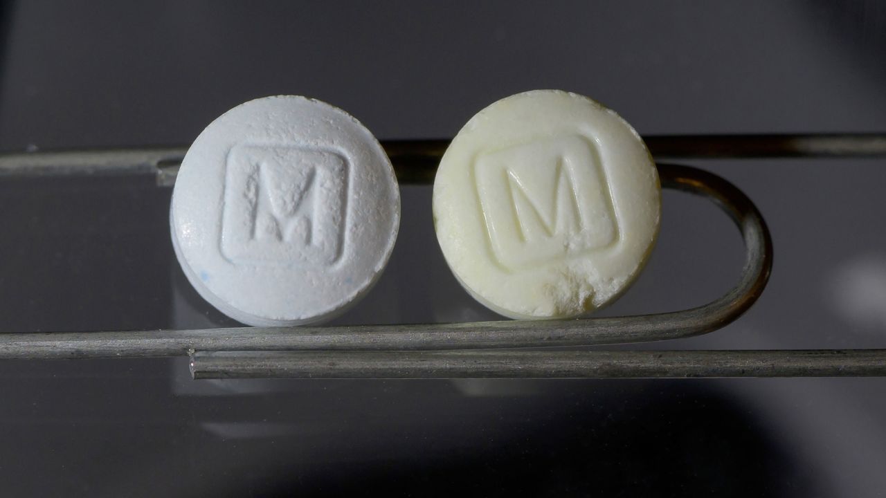 An image from the DEA shows an authentic 30mg oxycodone pill on the left, and a counterfeit pill on the right.