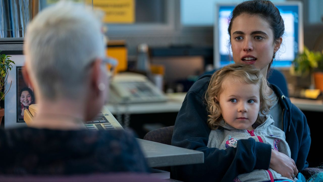 Margaret Qualley as Alex (far right) holds Rylea Nevaeh Whittet as Maddy in a scene from "Maid."