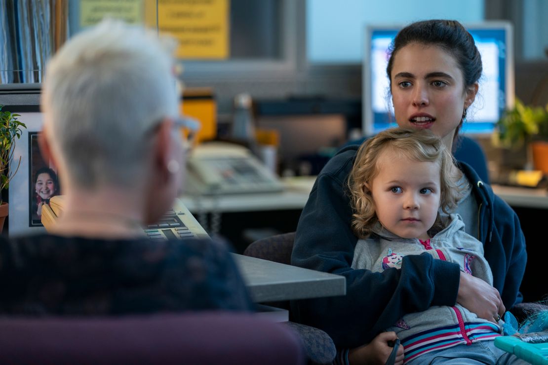 Margaret Qualley as Alex (far right) holds Rylea Nevaeh Whittet as Maddy in a scene from "Maid." 