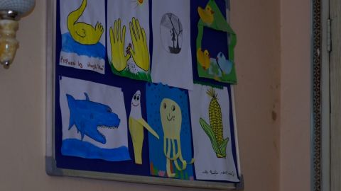 Art hangs on the wall at Walid's home in Kabul.