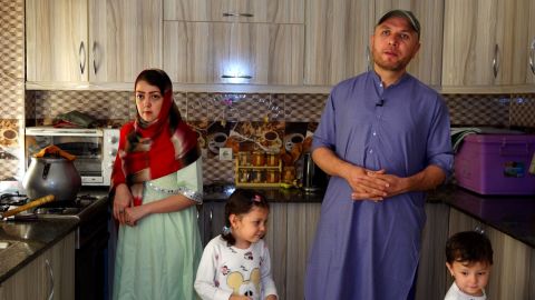 NEI's country director Walid at home with his wife and two daughters.