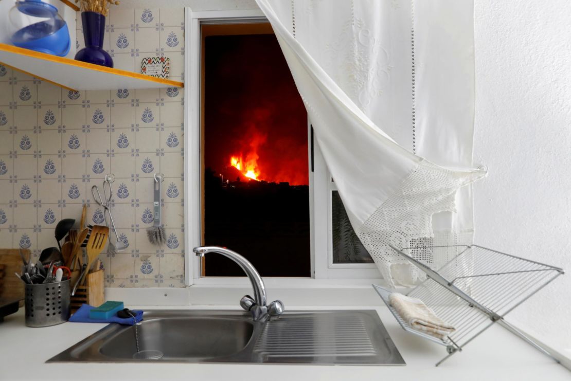 Lava is seen through the window of a kitchen from El Paso on September 28, 2021.