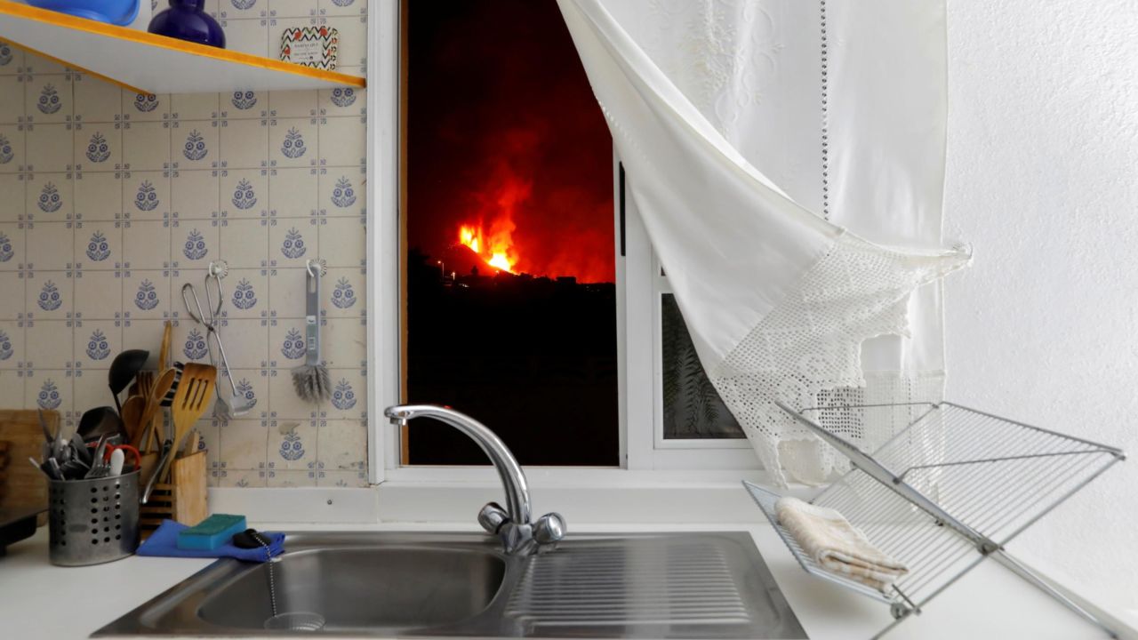 Lava is seen through the window of a kitchen from El Paso on September 28, 2021.