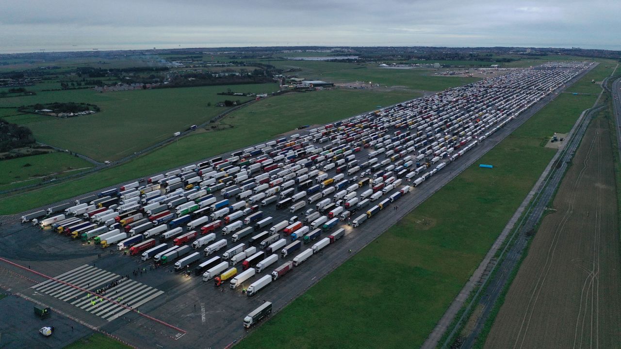 Trucks parked on the runway at Manston Airport in England waiting to cross the English Channel on December 22, 2020.