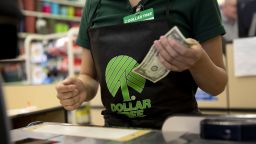 An employee works at a cash register at a Dollar Tree Inc. store in Chicago, Illinois, U.S., on Tuesday, March 3, 2020. 