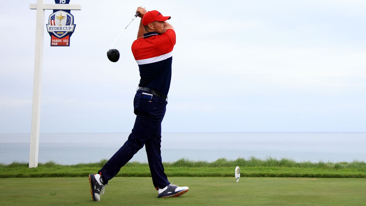 DeChambeau drives from the 16th tee during Sunday's Singles matches.