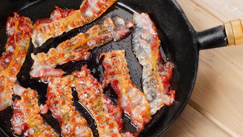 Cooked bacon on a skillet.
