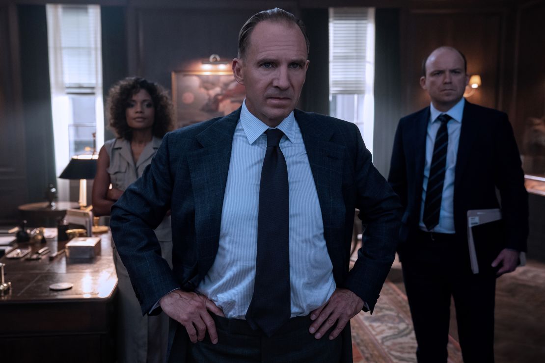 With Paul Nash's "Battle of Germany" to their backs, M (Ralph Fiennes), Moneypenny (Naomie Harris) and Tanner (Rory Kinnear) inside M's office.