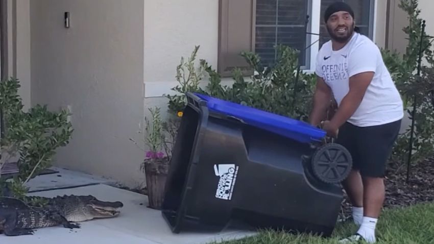 florida man fights alligator trash can wesh 1