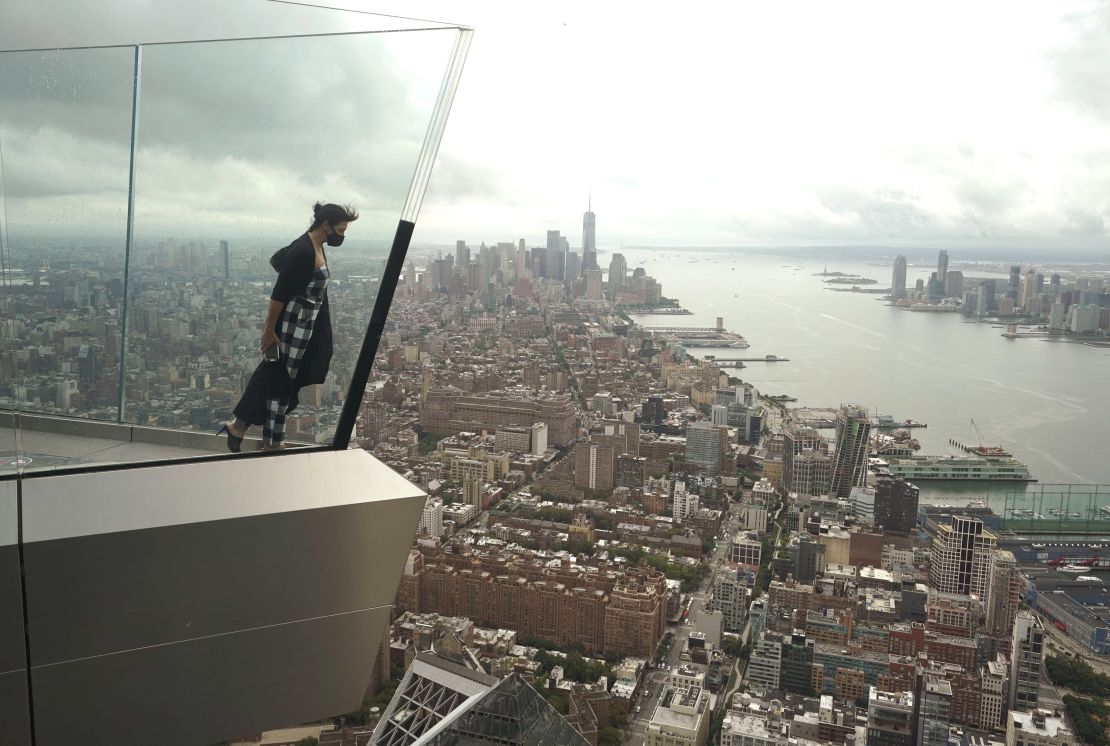 A visitor looks out over Manhattan and beyond from the Edge, the highest outdoor sky deck in the Western Hemisphere. It's located at Hudson Yards.