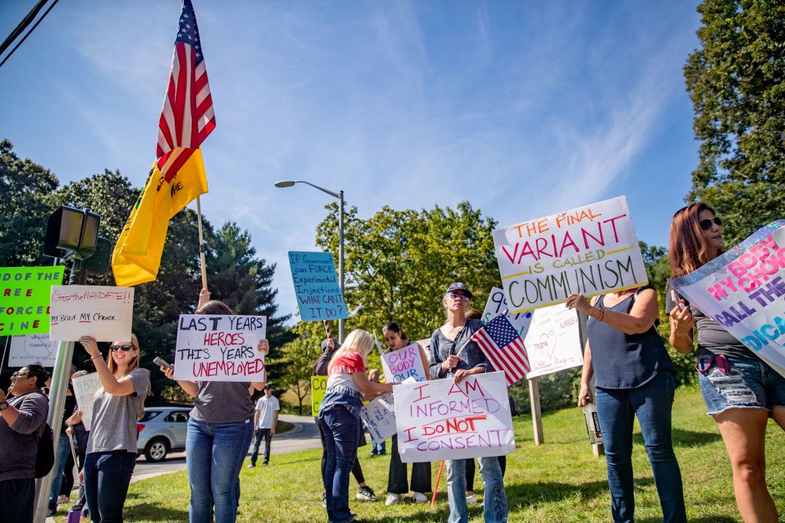 About 30 health care workers protest this week against state-mandated Covid-19 vaccinations outside St. Catherine of Siena Hospital in Smithtown, New York.