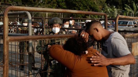 Relatives of prisoners await news outside the Litoral penitentiary in Guayaquil on September 29.